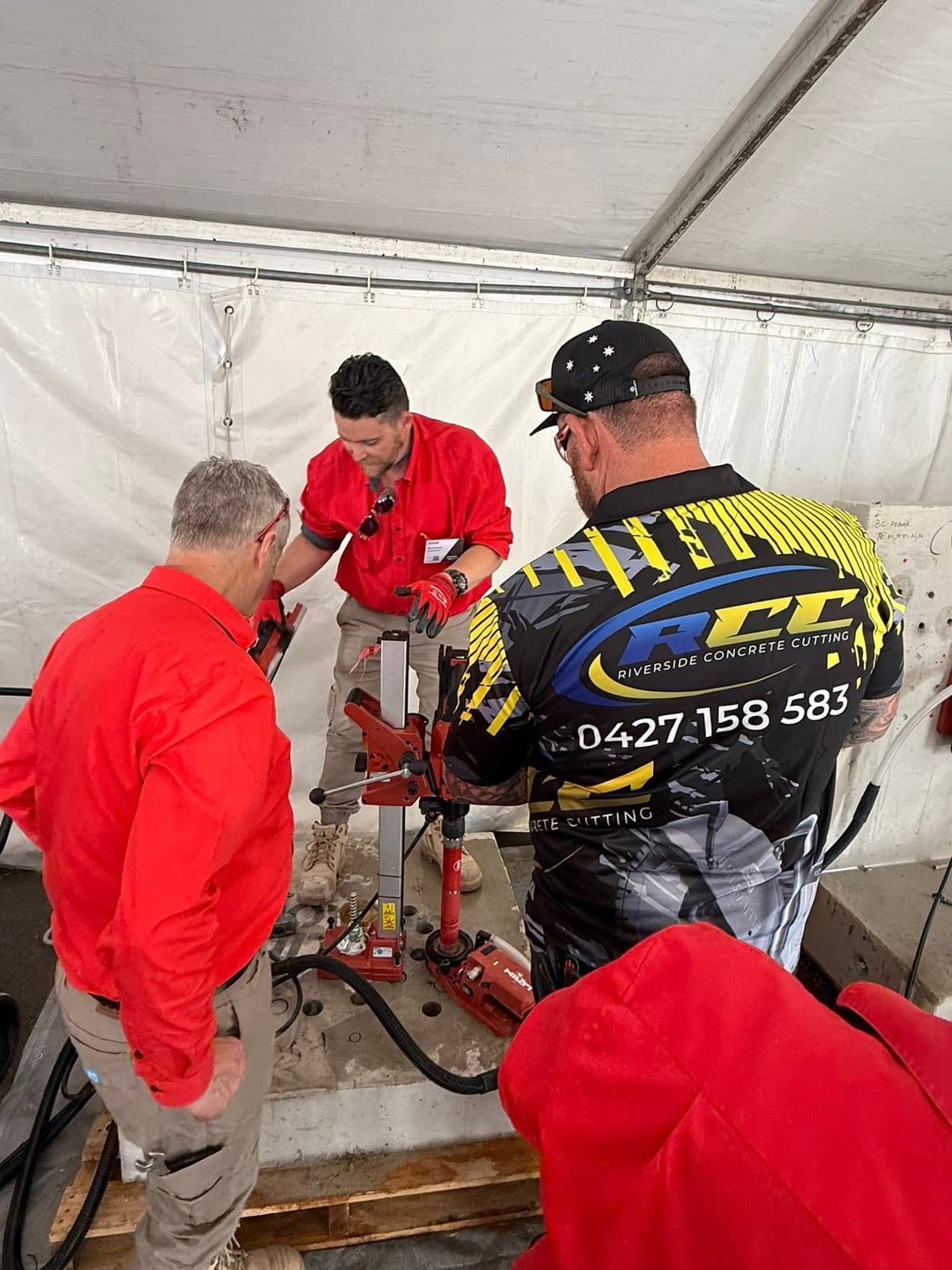 Riverside Concrete Cutting crew running a Hilti core drilling rig with Hilti technicians